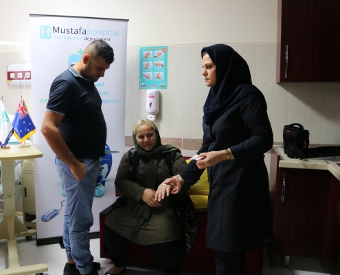 nurse checking patient condition in Mustafa hospital