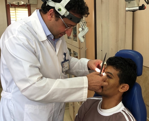 Dr Peyman Boromand Iranian nose surgeon removing nose bandage