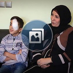 Iraqi boy patient with mom having eye surgery in Iran