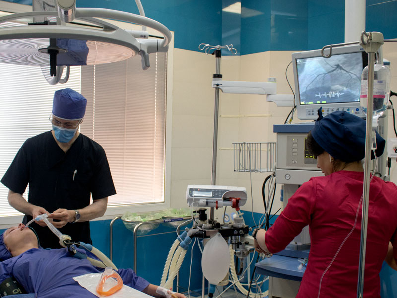 doctors in operating room operating on a patient