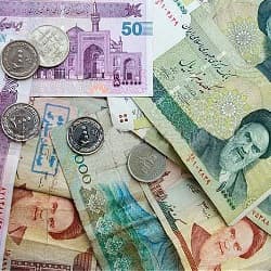 different Iranian banknotes and coins